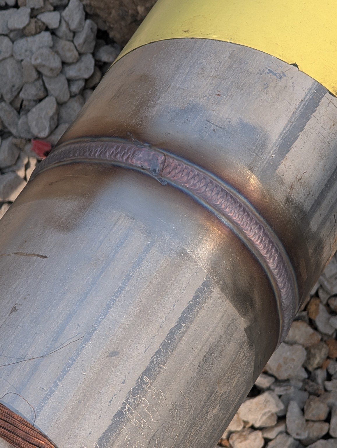 Close-up of a completed pipe weld