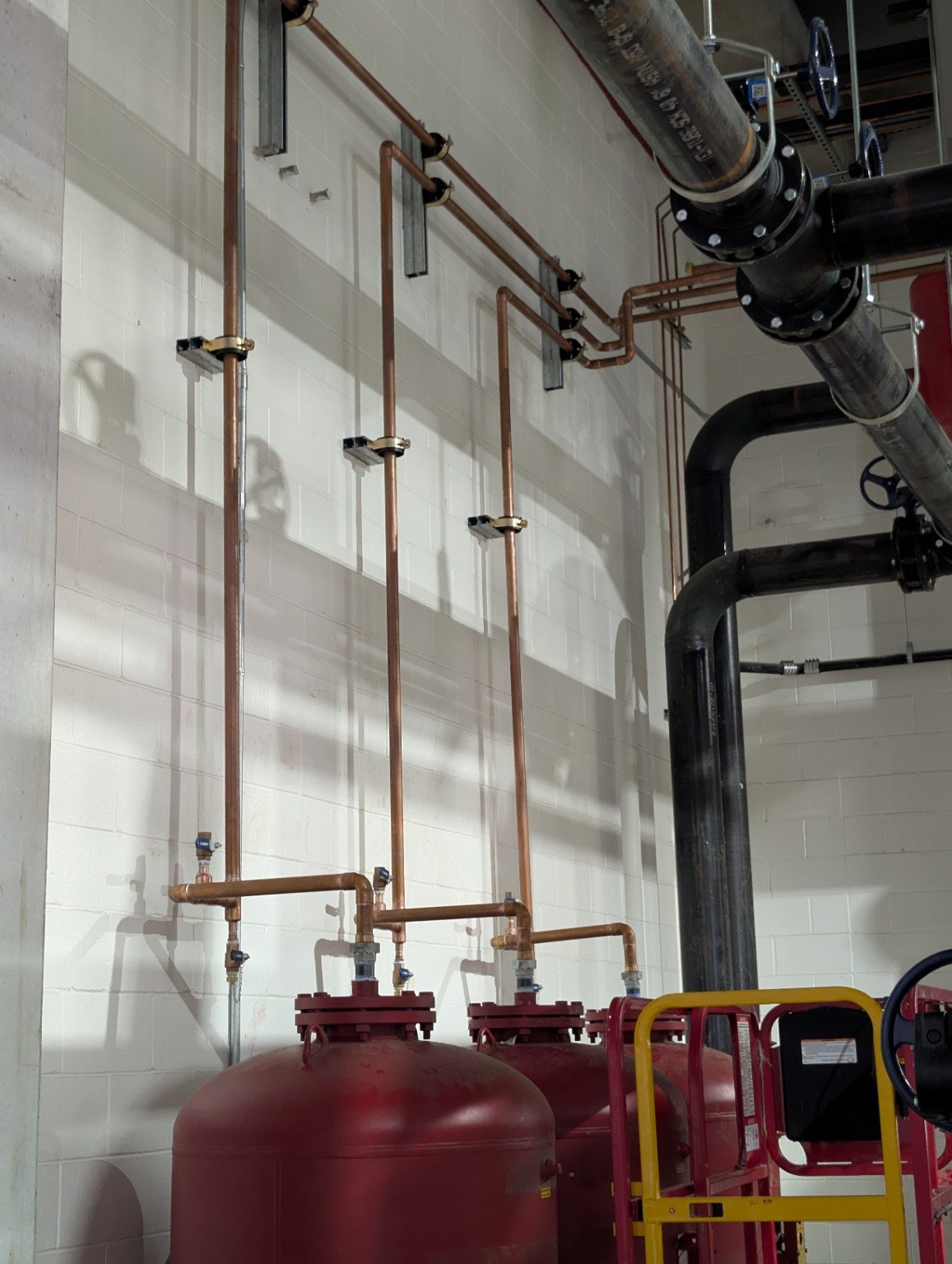 Tank piping with copper and steel lines